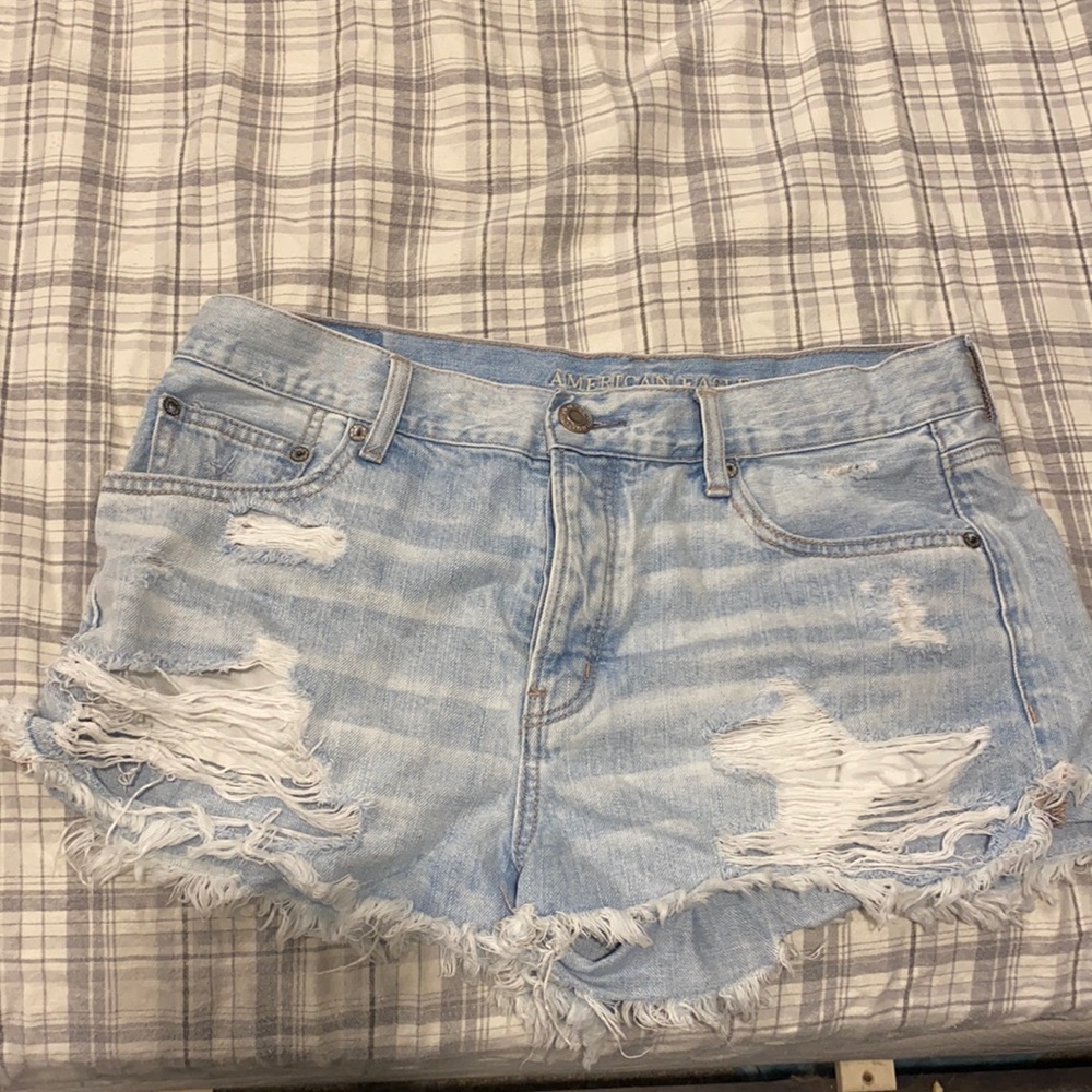 American eagle light wash ripped jean shorts. Never worn size 12